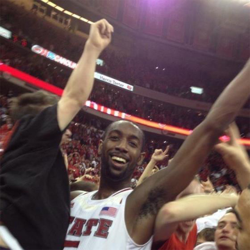 Will Privette being held up by CJ Leslie during the court storming.