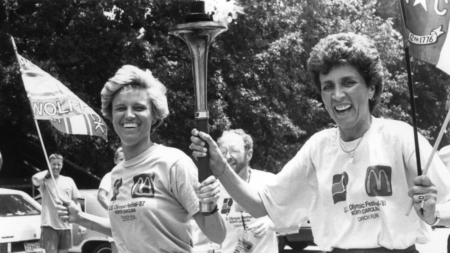 Kay Yow carrying the Olympic Torch in a Raleigh parade.