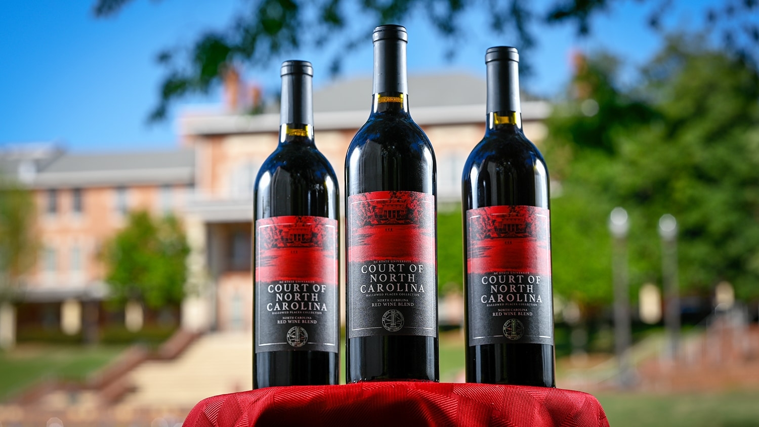 Three bottles of NC State's second wine in its licensed wine series pictured at the Court of North Carolina.