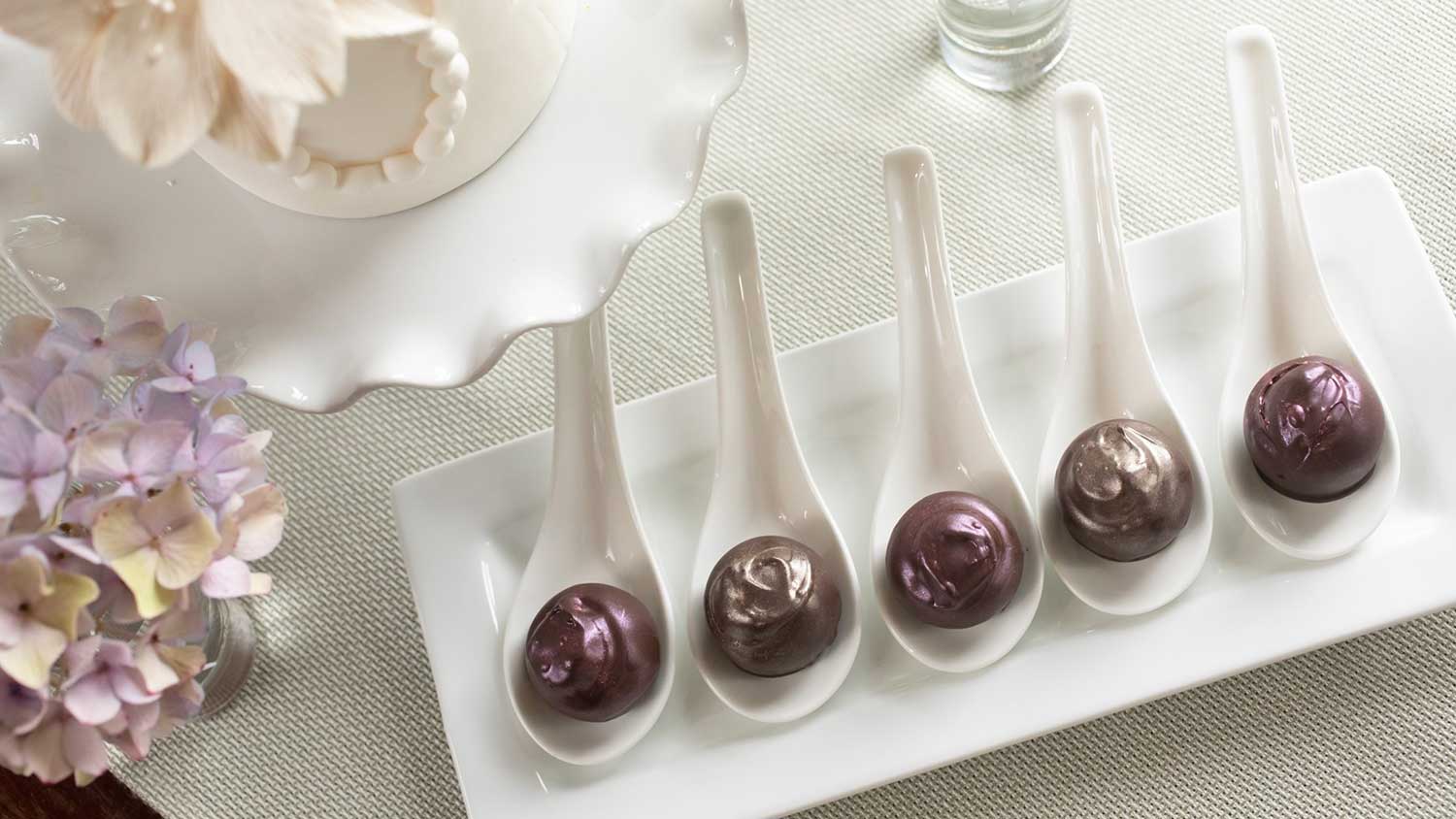 An assortment of Baxley's Chocolates, carefully presented on a white tablecloth.