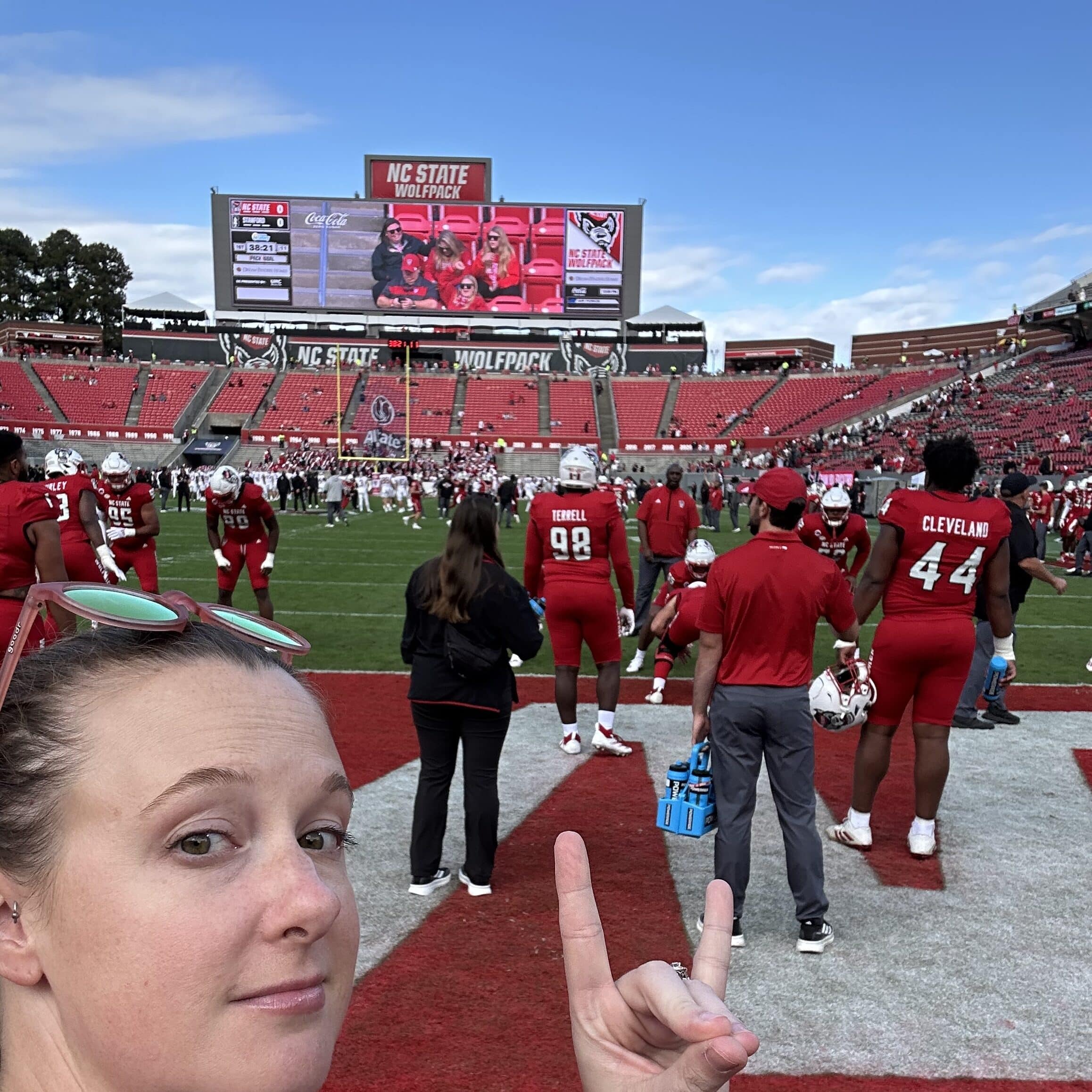 Rachel poses for a selfie on the field at Carter-Finley
